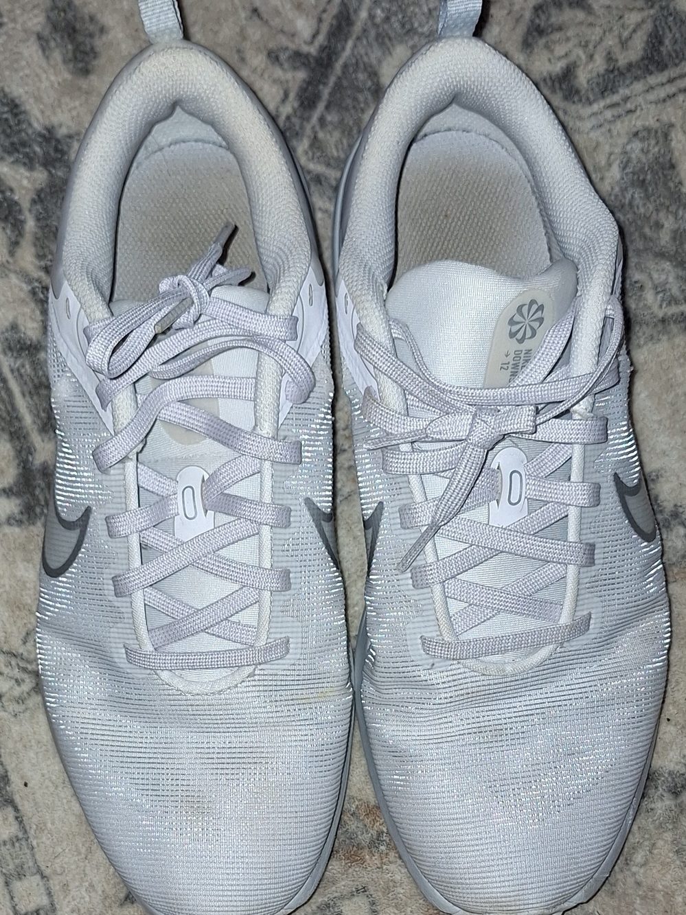 Nike Women’s White Athletic Running Shoes with Silver Swoosh